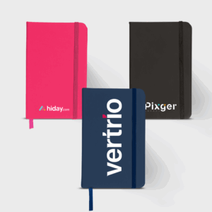 Carnets personnalisés rose, bleu et noir.