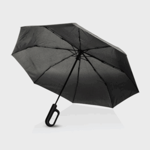 Parapluie noir ouvert sur fond blanc