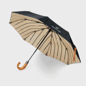 Parapluie noir à motif beige rayé.