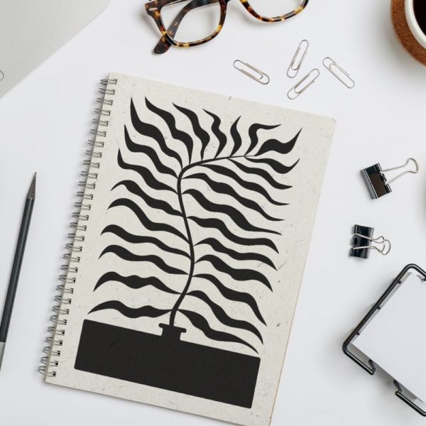 Carnet avec motif plante abstraite, pince et lunettes