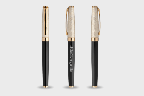 Stylos élégants avec capuchons dorés et noirs.