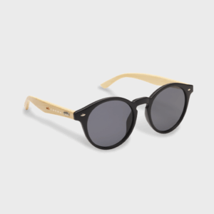 Lunettes de soleil rondes, branches en bois clair.