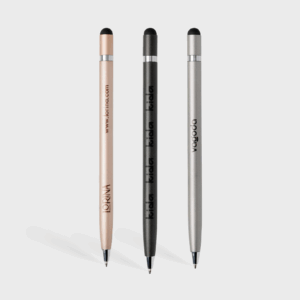 Trois stylos à bille élégants, couleurs variées.