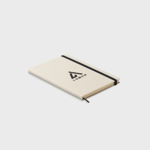Carnet beige avec élastique noir.