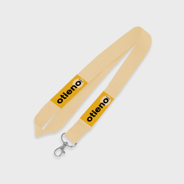 Cordon beige avec étiquette jaune et clip métallique.