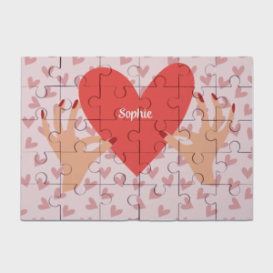 Puzzle cœur avec nom Sophie et mains.